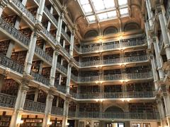 Interior of George Peabody Library showing ornate multi-level balconies and skylight