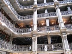 Interior view of George Peabody Library with ornate balconies and tall bookshelves