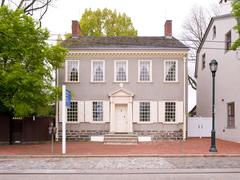 Exterior of historic two-story Germantown White House with central doorway and two end chimneys