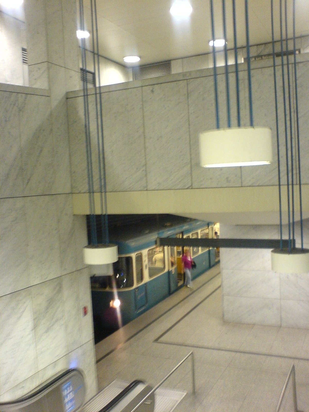 Stairs leading to the platform at U-Bahnhof Arabellapark metro station in Munich