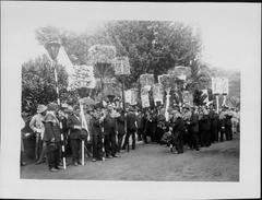 Funeral procession of Jonah Kūhiō Kalanianaʻole with traditional Hawaiian attendees and floral tributes