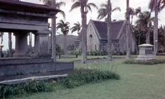 Royal Mausoleum in Hawaii surrounded by lush greenery under blue sky