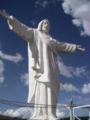 Statue of Christ overlooking Machu Picchu in Peru