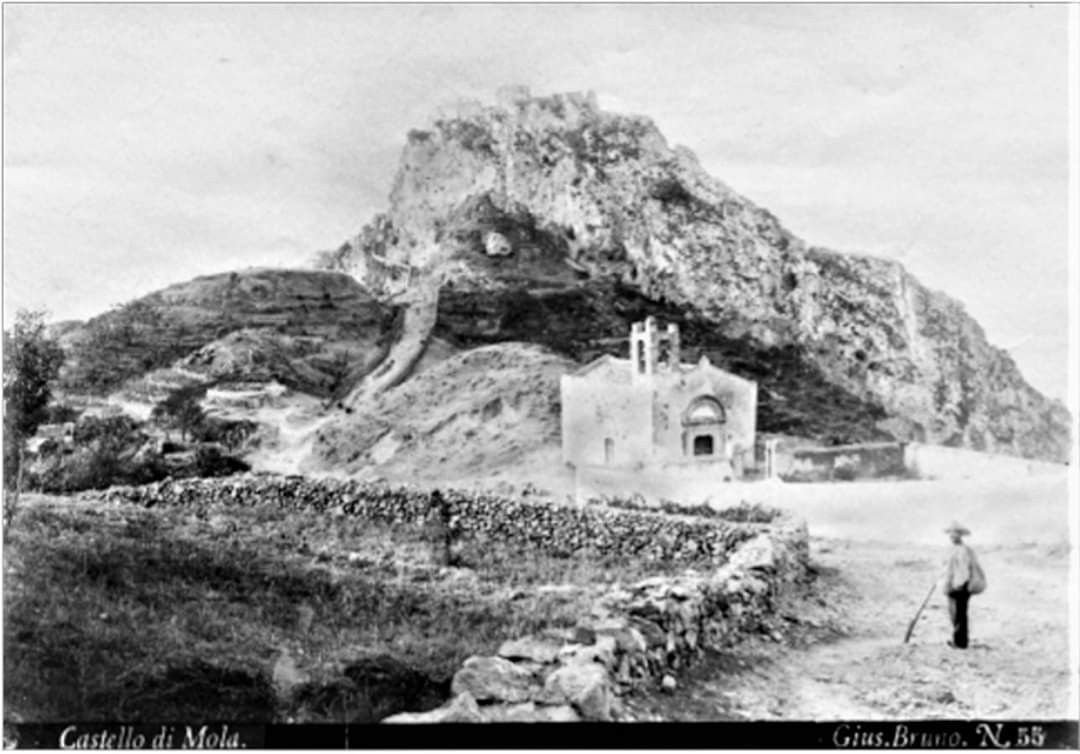 The Annunziata Church and cemetery near Castelmola with Castello di Mola in view