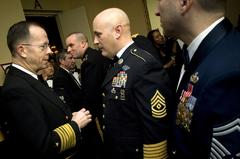 U.S. Navy Adm. Michael G. Mullen speaking with U.S. Army 1st Sgt. Troy Steward at the 46th Annual USO of Metropolitan New York Armed Forces Gala in 2007