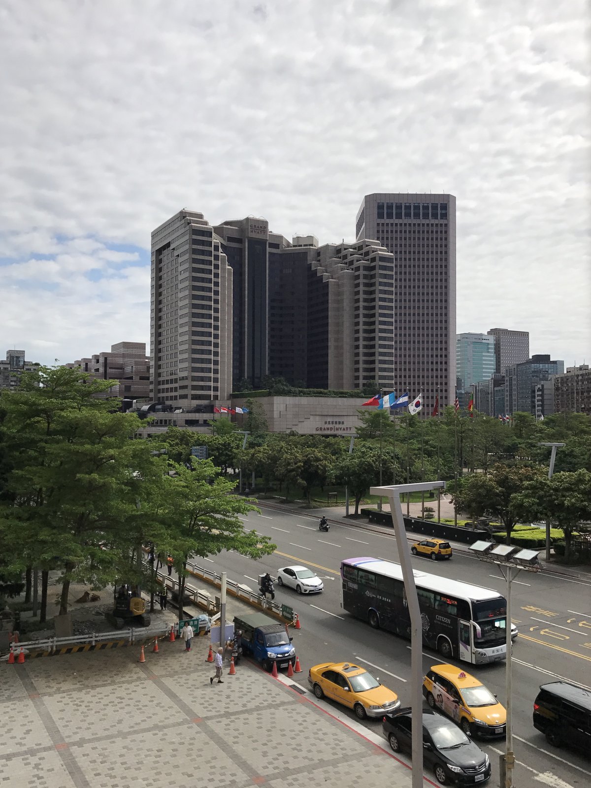 View of Grand Hyatt Taipei from the 4th floor restroom of Taipei City Hall building, showing the hotel and City Hall Road
