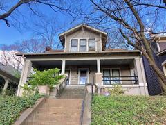 Scenic view of Grant Park boulevard in Atlanta with lush greenery and historic homes