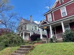 Scenic view of Grant Park boulevard in Atlanta with lush green trees and historic architecture