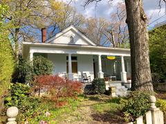 Scenic view of Cherokee Avenue in Grant Park, Atlanta with lush green trees and a clear blue sky