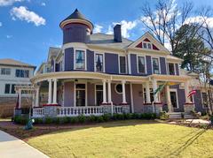 Grant Park entrance on Augusta Avenue with historic houses and lampposts in Atlanta