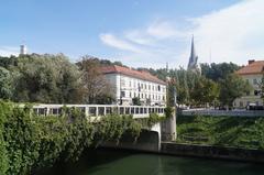 View of St. James's Bridge over the Ljubljanica River in Ljubljana with historic buildings