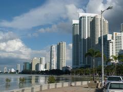Gurney Drive waterfront promenade in George Town with palm trees and city skyline