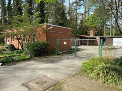 Ohlsdorf Cemetery greenhouse near chapel 7 surrounded by greenery