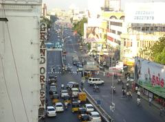 Anna Salai street near old Anand Theater in Chennai with vehicles and buildings