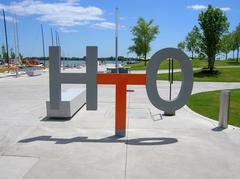 HTO Park entrance sign with trees and clear sky in Toronto Canada