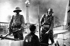 Imperial Japanese Army 18th Division soldiers conducting checkpoint in Guangzhou, China, October 1938