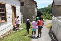 Children walking between overseer's house and enslaved quarters at Hampton National Historic Site