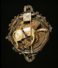 Carved wooden ceiling boss from Linlithgow Palace showing Scotland's heraldic unicorn holding Union flag on a lance
