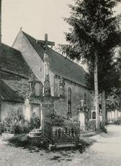 Partial view of Meistratzheim cemetery with tombstones and greenery