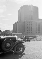 1934 Reykjavik Theater Tower with vintage car parked nearby