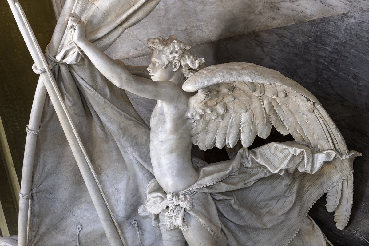 Marble monument with a solemn figure holding a ship helm, located in Italy's cultural heritage site