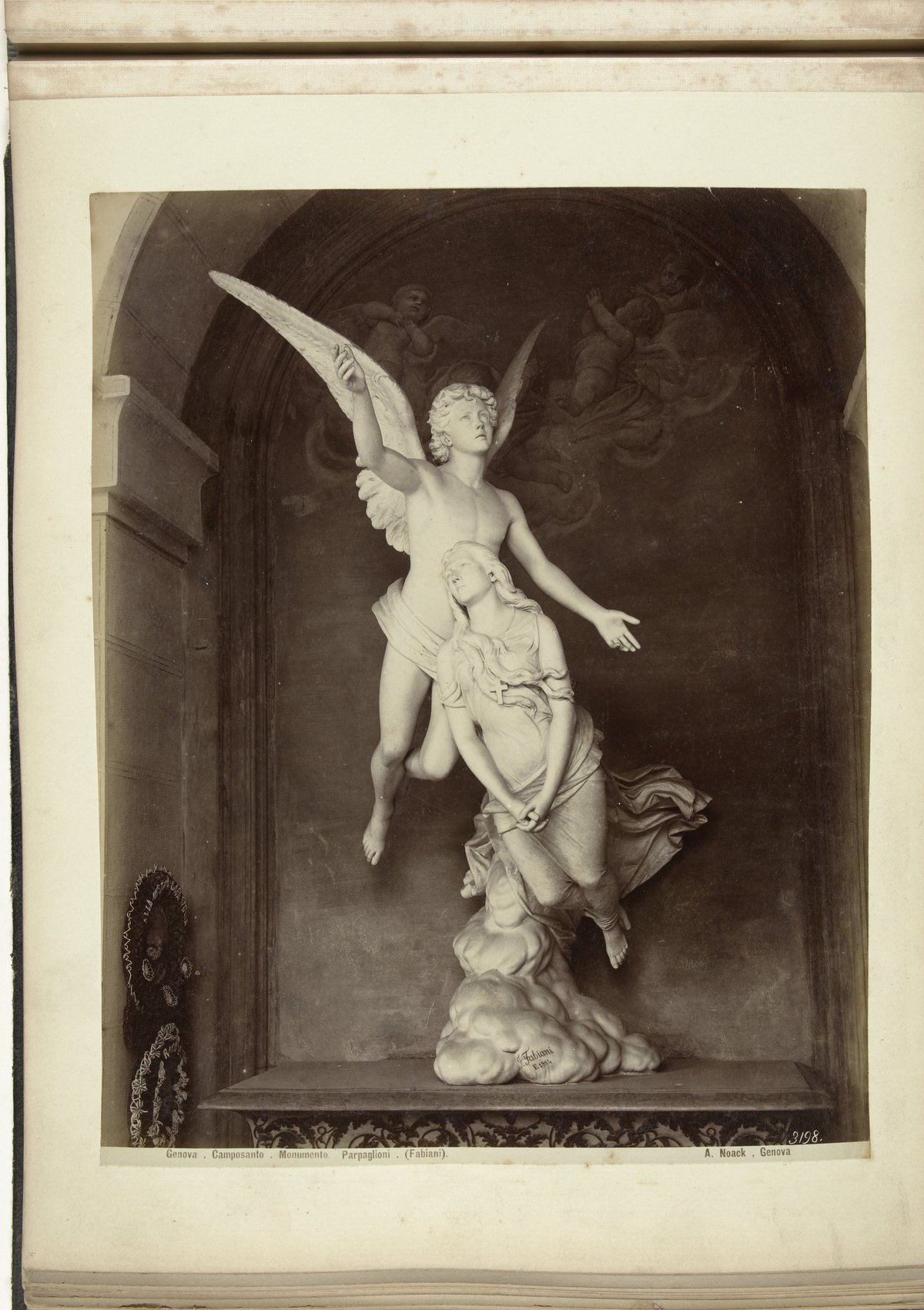 Monument in Genova Camposanto depicting a woman ascending to heaven guided by an angel