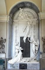 Restored cemetery monument with intricate design