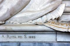 Restored cemetery monument with artist's signature