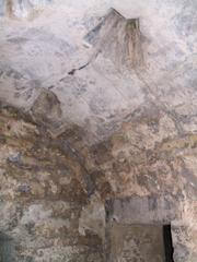 Ancient Baños del Alcázar Califal in Córdoba with detailed stone architecture and arches