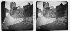 Street and tower of Begur in a black and white photo by Josep Salvany i Blanch from 1917