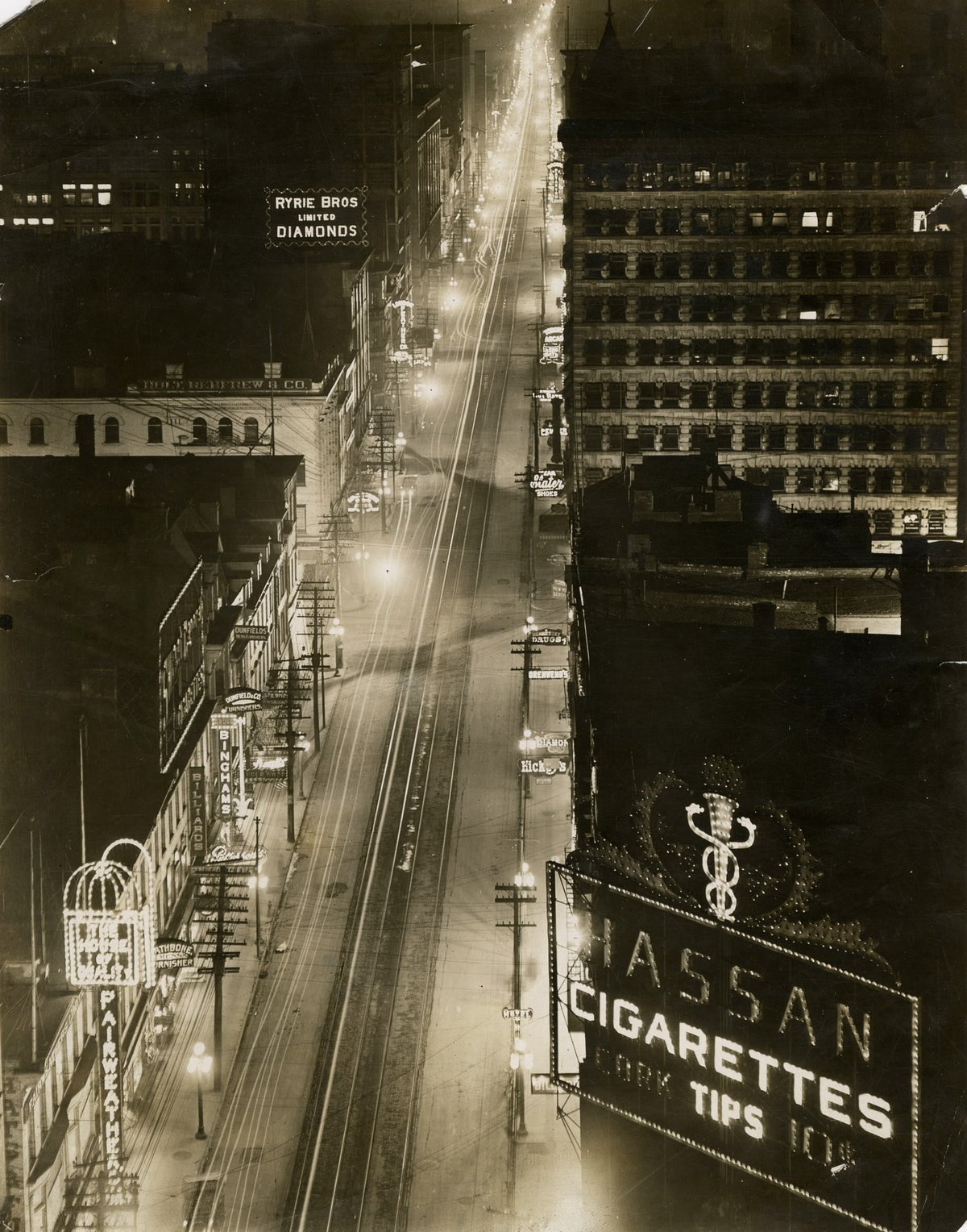 Yonge Street at night in Toronto, view from Canadian Pacific Building showing illuminated storefront signs
