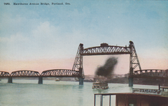 Hawthorne Avenue Bridge in Portland raised with riverboat passing