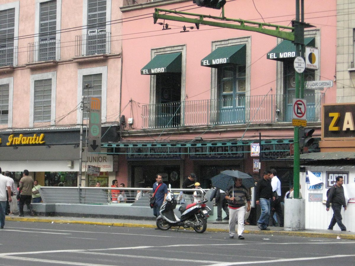 Entrance to San Juan de Letrán Metro station on Line 8 in Mexico City with El Moro churros shop in the background