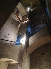 Interior view of the Ghirlandina Tower in Modena with ancient stone walls and architectural details