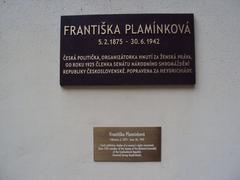 Memorial plaque of Senator Františka Plamínková on the back of the Wallenstein Palace viewed from the garden