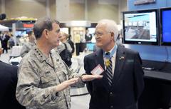 Commander General Stephen R. Lorenz and Medal of Honor recipient retired Colonel James P. Fleming discussing aviation technology at 2010 Air Education and Training Command Symposium