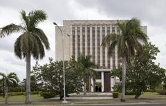 Library building on Revolution Square in Havana, Cuba with colonial architecture and palm trees