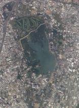 Scenic view of Toapi Lake (Chengcing Lake) surrounded by greenery in Kaohsiung County
