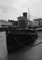Steam tug Hercules at Hyde Street Pier in San Francisco showing port bow and wheelhouse