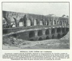 Los Caños de Carmona historic site in Sevilla with stone aqueduct structures and lush greenery
