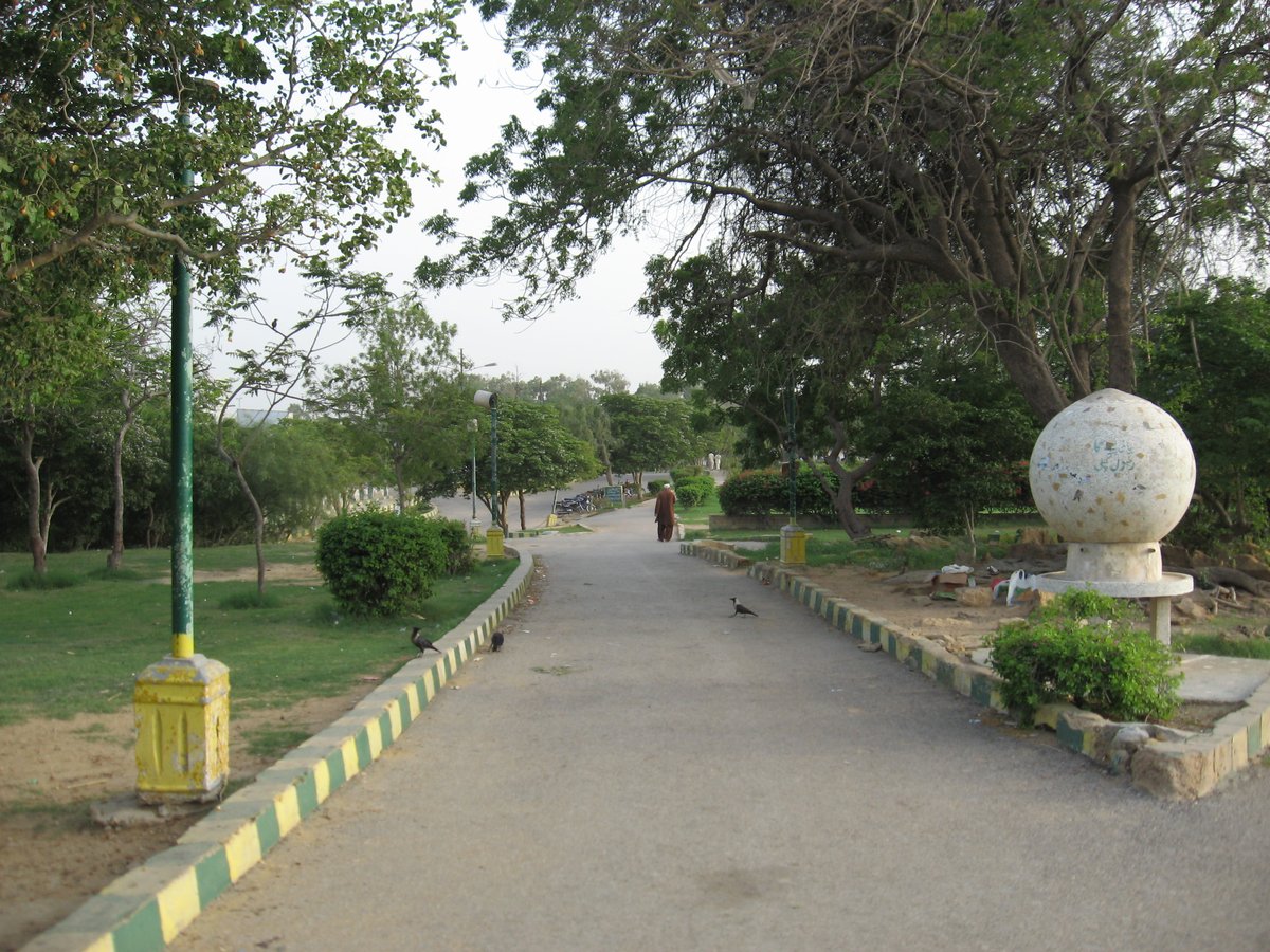 Scenic view of Hill Park in Karachi, Pakistan with lush greenery and cityscape in the background