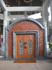 Traditional wooden door with intricate carvings at Istana Budaya in Kuala Lumpur