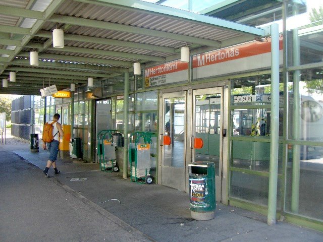 Herttoniemi metro station entrance with stairs and escalator in Helsinki