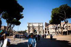 Ancient Roman ruins in Rome with ruins set against a bright blue sky