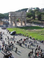 Arch of Constantine in Rome with detailed sculptures and blue sky