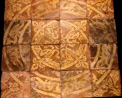 Medieval tile displayed at the Palais du Tau in Reims, France