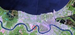 New Orleans skyline and Lake Pontchartrain with Huey P. Long Bridge marked by a red circle on April 26, 2000
