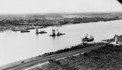 Construction of the Huey P. Long Bridge in Jefferson Parish Louisiana showing workers and cranes