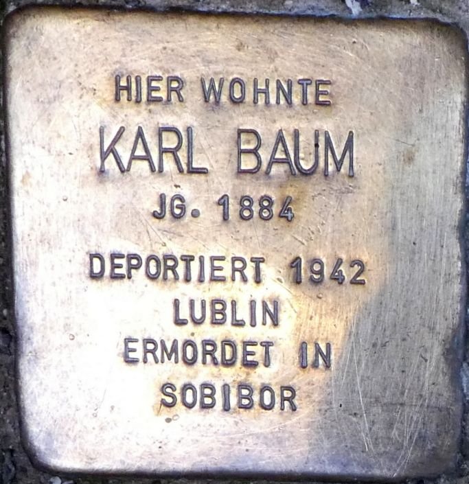 Stolperstein dedicated to Karl Baum in Wiesbaden, Germany embedded in the pavement