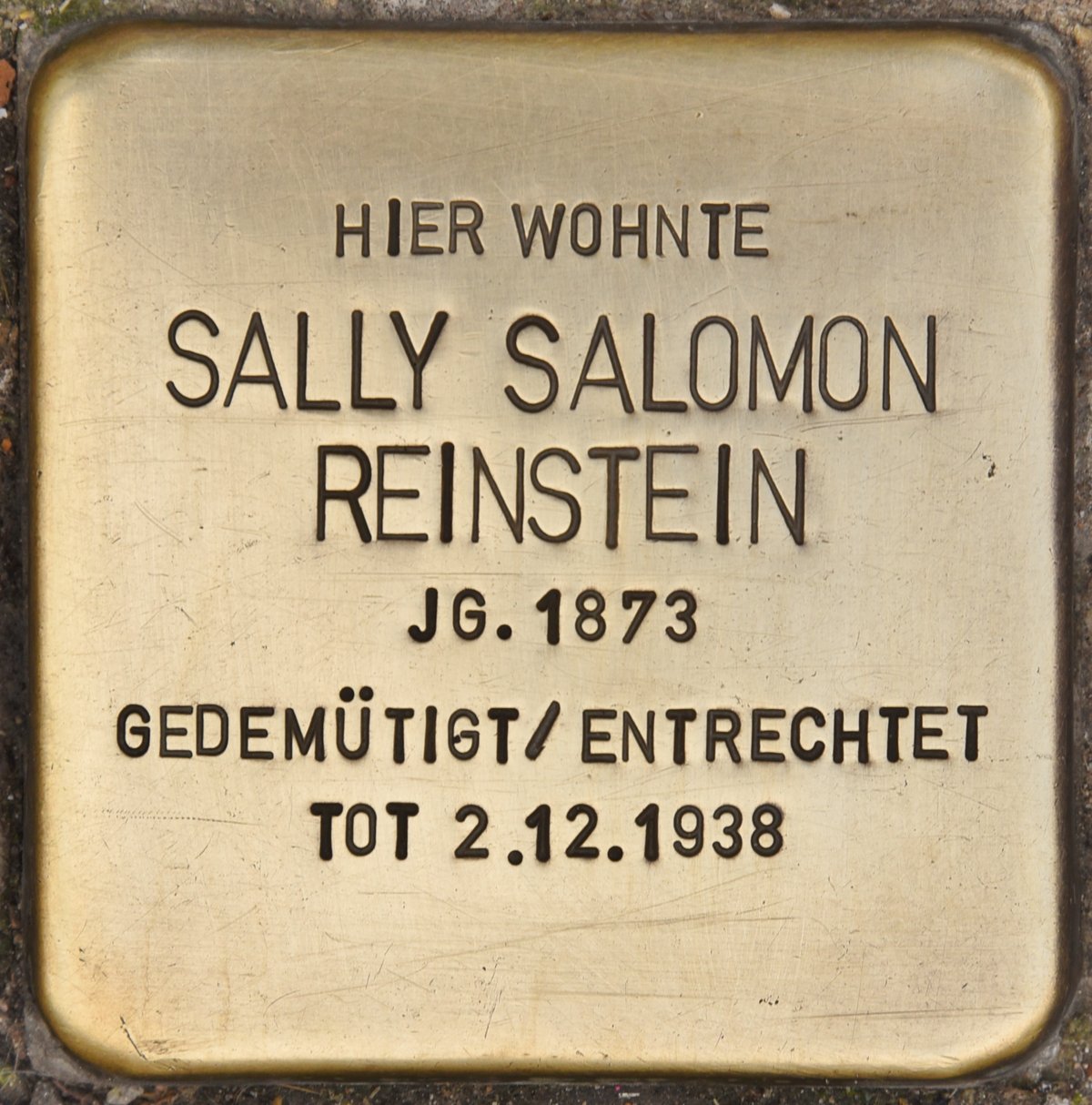 Stolperstein commemorative brass plaque dedicated to Sally Salomon Reinstein embedded in a sidewalk in Wiesbaden, Germany